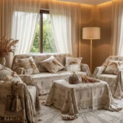 Elegant living room set with decorative fabric interior wrapping and matching patterned throws on sofas and chairs.